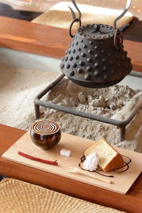 Image of coffee and chiffon cake placed in front of hearth